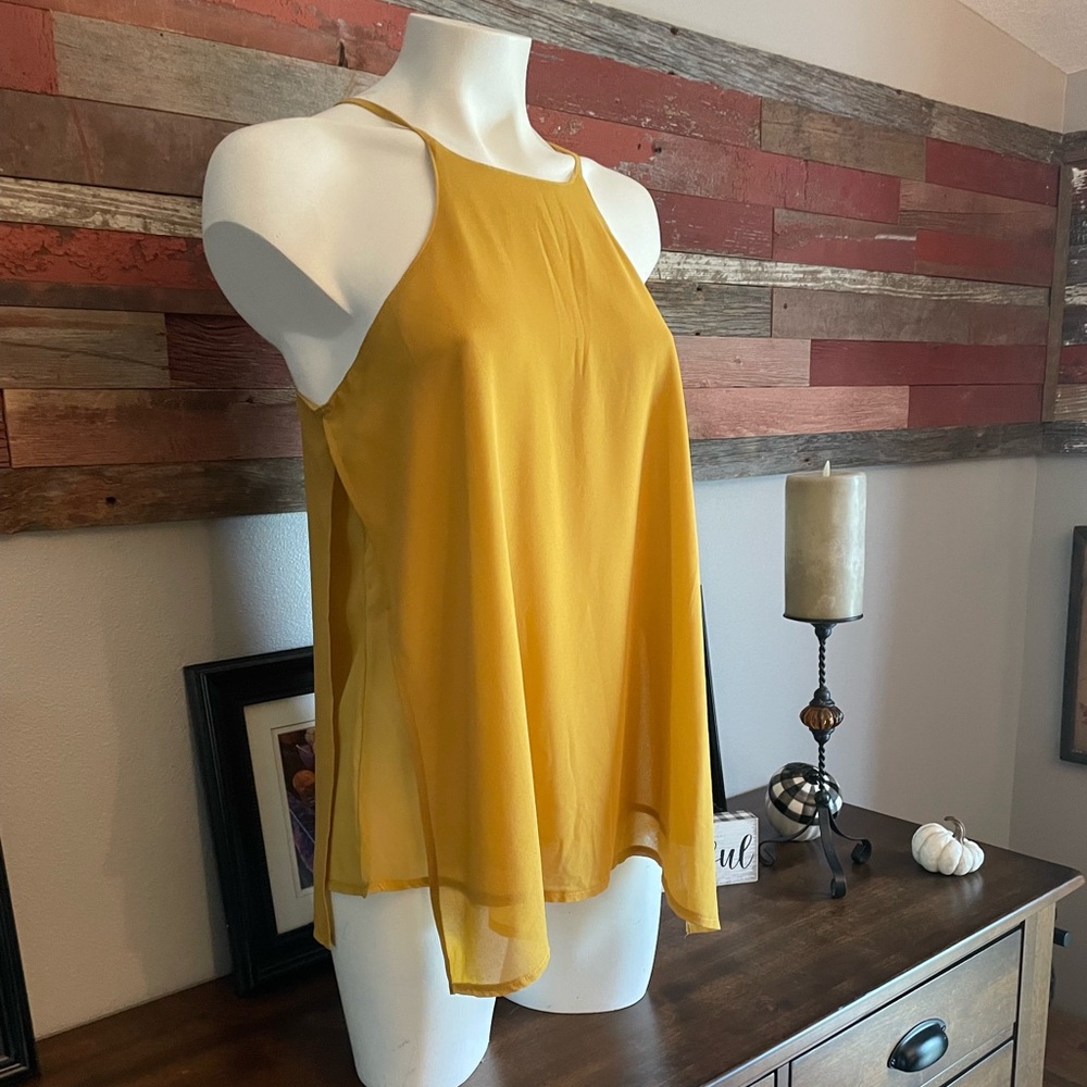 Bishop and Young mustard colored top